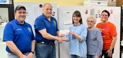 Grand Knight Jim Young (second from left) and Past Grand Knight Matthew Sheaffer of Msgr. George V. Lentocha Council 3501 in Middletown, Pa., present staff and volunteers of Middletown Interfaith Food Pantry with a $300 check. 