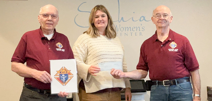 Grand Knight David Bedell (right) and Financial Secretary John Staudt of Salem (Ohio) Council 1818, present a $1,000 check to Carrie Pennington, executive director of the Sophia Women’s Center, to help cover operating costs for the center’s ultrasound machine. 