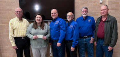 Knights from Goliad (Texas) Council 7512 present a check for over $3,000 to Victoria Gonzales, executive director of the Gabriel Project of the Crosswords, a church-based ministry that provides emotional, material, educational and spiritual support to pregnant women in need.