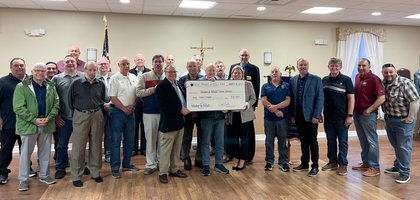Members of Prince of Peace Council 5903 in Englishtown, N.J., present a $10,000 check to Tracey Taylor, major gift officer for Make-a-Wish New Jersey. The funds will cover the trip and lodging of a 4-year-old boy with cancer to Disney World. 