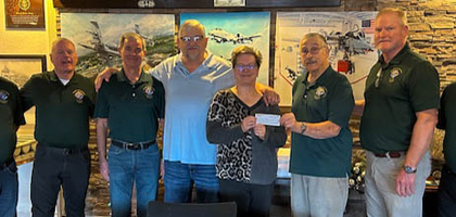 Grand Knight James Bottone (third from right) and other members of St. Patrick of Arcola Council 13971 in Fort Wayne, Ind., present a $2,500 check to Tracey Barr, director of veteran outreach at Shepherd’s House, a faith-based recovery program for veterans experiencing homelessness. The Knights have supported the organization for the past seven years.