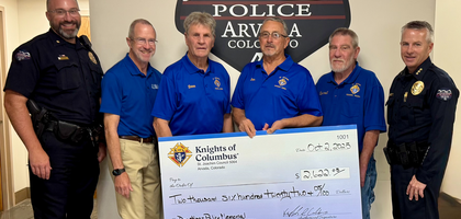 Knights from St. Joachim Council 5064 in Arvada, Colo., present a check for more than $2,600 to officers of the Arvada Police Department for the department’s foundation. The funds will support construction of a $500,000 garden to honor officers killed in the line of duty, scheduled for completion in May 2026.