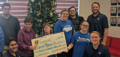Members of Iowa Great Lakes Council 5043 in Spirit Lake, Iowa, present a $2,500 check — raised from the council’s annual fund drive for people with disabilities — to Special Olympics coach Paula Gomez and Special Olympics athletes. An additional $2,500 was given to Hope Haven, an organization that provides services for people with disabilities.