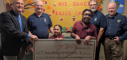 Knights from Cathedral of St. Catharine of Siena Council 14397 in Allentown, Pa., present a donation of nearly $1,900 to Mark Napierkowski, development director at Mercy School for Special Learning, and students. The council has supported the school since 2018, with donations totaling more than $7,100.