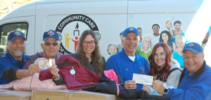 Members of St. Helen of the Cross Council 15999 in Beamsville, Ontario, present a check for CA$1,000 and boxes of winter coats to representatives of Community Care of West Niagara, a local food bank. The funds will support the food bank’s annual drive, and more than 150 coats purchased through the Coats for Kids program were distributed to people in need. (Photo by Joanne McDonald)
