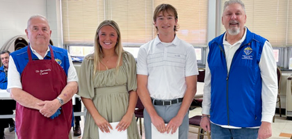 Grand Knight Greg Ulyan (right) and John Place, members of Bradford (Pa.) Council 403, stand with graduating high school seniors Isabella Rhoades and Owen Manion, this year’s recipients of the council’s annual scholarships. 