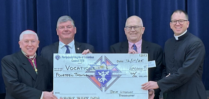 Members of Perrysburg (Ohio) Council 7978 present a $14,000 check to Bishop Daniel Thomas (left) of Toledo and diocesan vocations director Father David Kidd after the annual diocesan seminarian Mass and brunch at Our Lady, Queen of the Most Holy Rosary Cathedral. The proceeds were distributed among the diocese’s seminarians for personal expenses. Over the past 13 years, the council has donated $112,000 to seminarians through the Order’s Refund Support Vocations Program (RSVP).