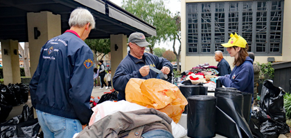 Members of Cypress (Calif.) Council 8599 sort through clothing collected during their 20th annual winter clothing drive at St. Irenaeus Catholic Church.