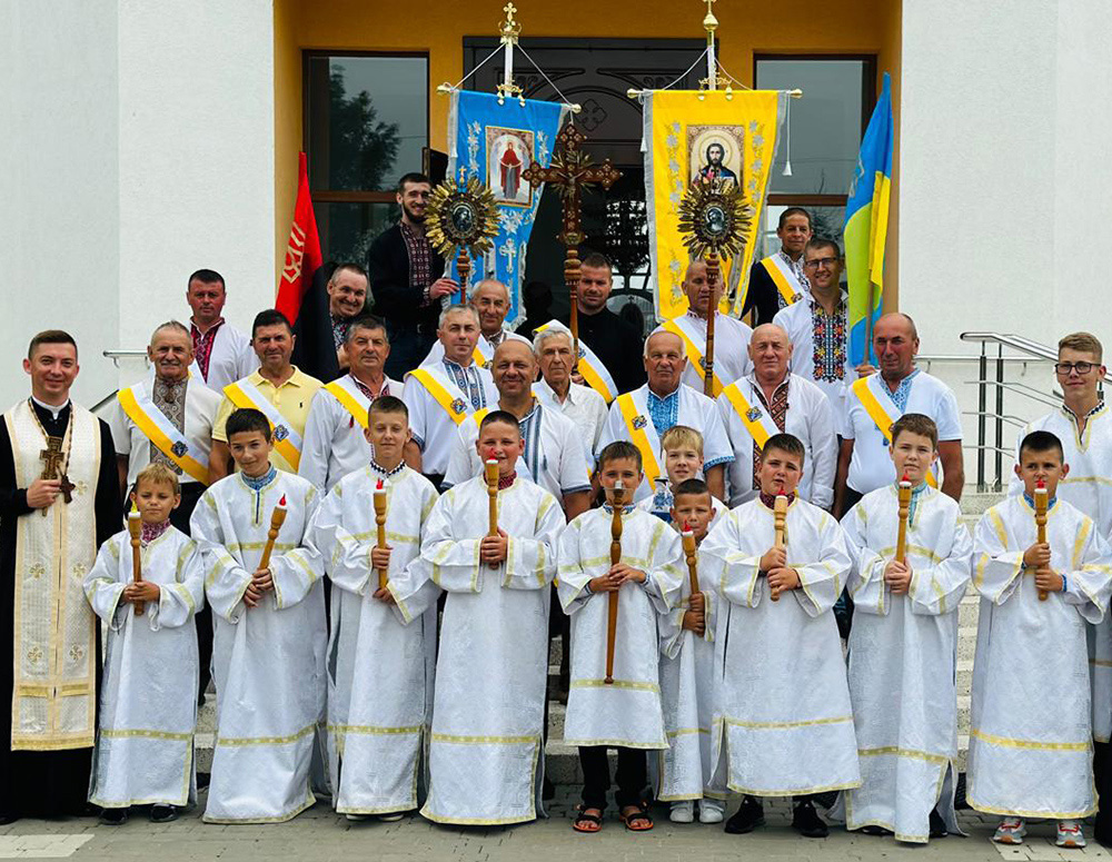 Knights from Holy Martyr Josaphat Council 18299 participate in an initiation ceremony of local altar boys at the Greek Catholic Church of the Intercession of the Blessed Virgin Mary in Holyn, Ukraine, in June. The council serves and strengthens the local parish by assisting the families of fallen soldiers in the community.