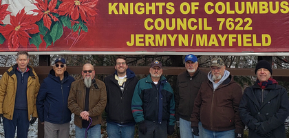 Knights from Sacred Heart of Mary Council 7622 in Jermyn, Pa., stand in front of a Keep Christ in Christmas billboard at the intersection of Washington Avenue and Eynon-Jermyn Road. The council has sponsored the billboard for more than 20 years, displaying it annually for more than a month during the Christmas season.