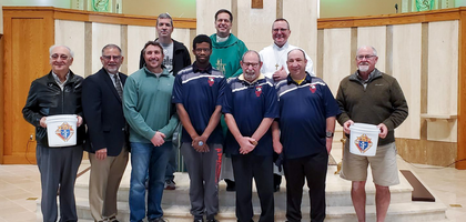 Members of Sayre (Pa.) Council 1807 present Special Olympic athletes to support costs associated with the athletes’ competing in national and international Special Olympics events. The funds came from a drive at the Church of the Epiphany.