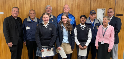 Grand Knight Daniel Fitzpatrick (back row, royal blue jacket) and other members of Father John LaFarge, S.J. Council 4012 in Yorktown Heights, N.Y., stand with students and faculty from St. Mary’s Academy and John F. Kennedy Catholic Preparatory School in Somers after the council’s Catholic Citizenship Essay Contest.
