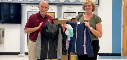 Past Grand Knight Bill Shustowski Jr. of Our Lady, Queen of Peace Council 11680 in New Port Richey, Fla., presents coats to Leona Wells, a managing director at Metropolitan Ministries East Pasco. The council spent nearly $8,000 to purchase more than 500 coats through the Knights of Columbus Coats for Kids program, which the Supreme Council matched, resulting in more than 1,000 jackets distributed in 2025. The coats were distributed to children in foster care in Pasco County, including at local schools.