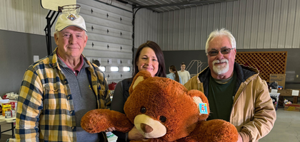 Past Grand Knight Philip Morrow (left) and Gary Kluver of Onawa-Blencoe (Iowa) Council 6249 hold a stuffed bear with Amy Johnston, director of West Central Community Action’s Monona County office, during the council’s toy drive. The council collected new toys, food, clothing and cash donations for West Central Outreach, which assists families in need. The council has organized the drive for more than 30 years, benefitting nearly 80 families in 2025.