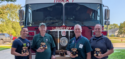 Grand Knight Jim Finn (second from right) and Joe Vogel, community director, of St. Kieran Council 13983 in Shelby Township, Mich., along with Shelby Township firefighters, display comfort teddy bears donated by the council. The bears will be given to children at fire and accident scenes and were donated in honor of Mark Semaan, a brother Knight and former battalion chief who died in 2022. The council has donated more than 350 bears to first responder agencies over the past five years.