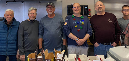 Members of Father John Crowley Council 3199 in Ridgecrest, Calif., and volunteers gather in St. Ann Parish’s kitchen on Christmas morning to prepare food for the council’s annual Christmas community dinner. Nearly 500 meals of turkey, ham and side dishes were served and delivered free of charge. About 15 Knights helped prepare, cook, serve and deliver the food.