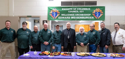 Knights from Msgr. Edward J. McCormick Council 521 in Port Huron, Mich., stand with Archbishop-elect Edward Weisenburger, a longtime Knight, during a reception to celebrate his appointment as the new archbishop of Detroit.