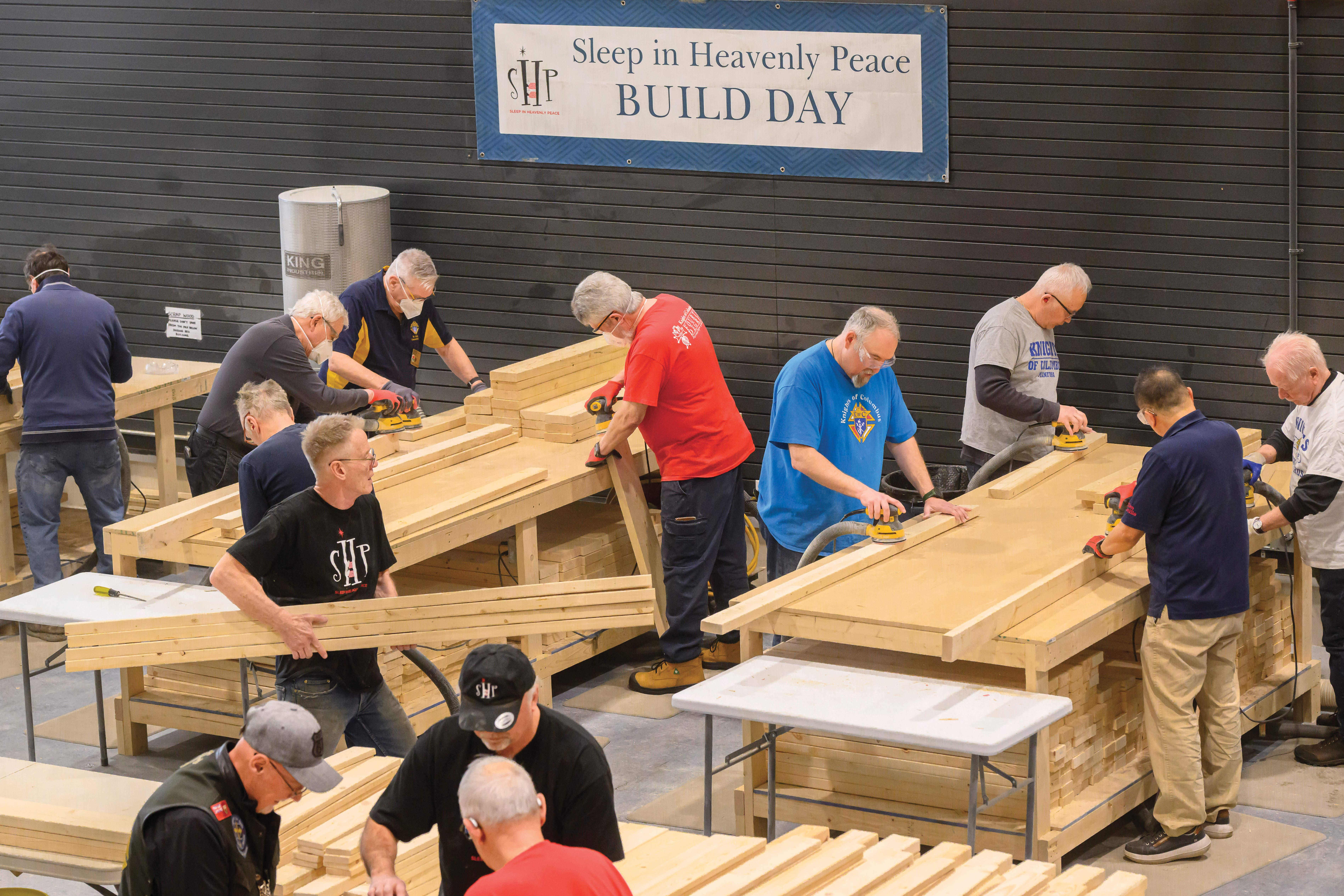 Manitoba Knights and other volunteers participate in a bed build with Sleep in Heavenly Peace in Winnipeg.