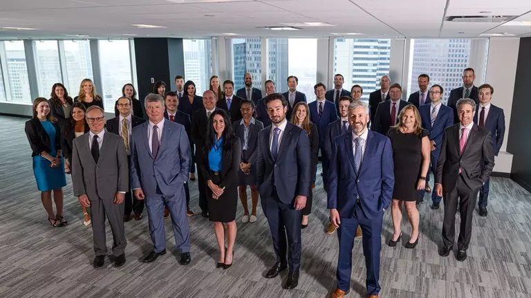 The Knights of Columbus Asset Advisor's team, standing and posing together for a photo.