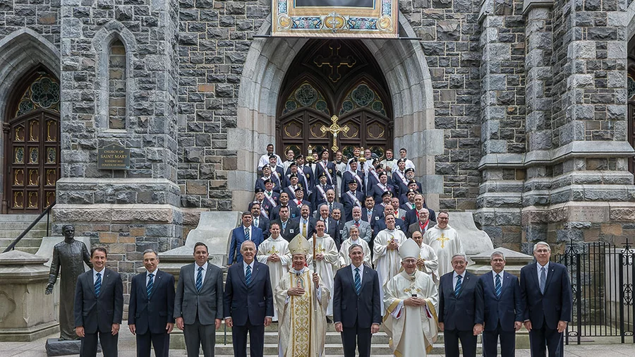 Following the Aug. 4 Memorial Mass celebrated by Supreme Chaplain Arch- bishop William Lori of Baltimore, Supreme Officers and members of the board of directors stand with Archbishop Leonard Blair of Hartford, concelebrating priests and Connecticut Knights outside St. Mary’s Church in New Haven, Conn. Photo by Aaron Joseph