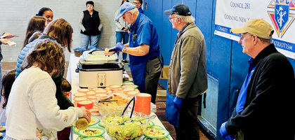 Members of Father Lewis E. Brown Council 281 in Corning, N.Y., serve salad, bread, and pasta e fagioli soup during the council’s annual free Lenten Soup Supper at All Saints Parish. About 70 people attended the event, with food prepared by Past Grand Knight Nicholas Ferratella Sr.
