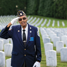 Lewis Reid gives a patriotic salute in Salisbury National Cemetery Annex