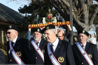 Knights of Columbus process in front of a wooden cross prior to Mass in Prescott, Ariz., to mark the start of celebrations for the Jubilee Year.