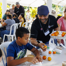 Jose Lebron-Sanabria serves food during the 6th American Missionary Congress