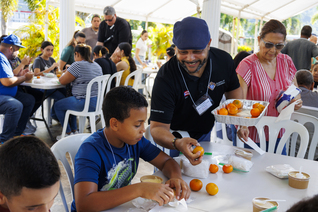 Jose Lebron-Sanabria serves food during the 6th American Missionary Congress