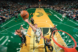 Luke Kornet grabs one of his nine rebounds against the Brooklyn Nets