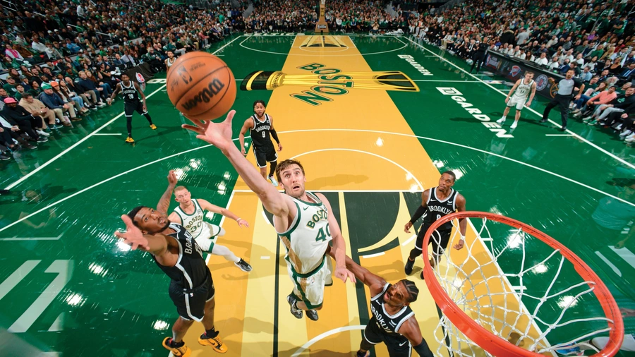 Luke Kornet grabs one of his nine rebounds against the Brooklyn Nets