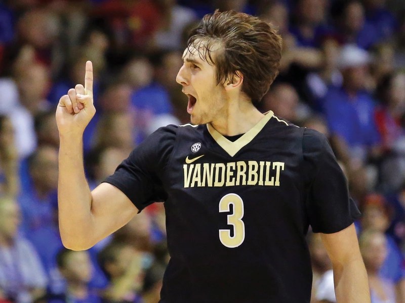 Luke Kornet, a forward at Vanderbilt, celebrates after sinking a 3-point shot against Kansas