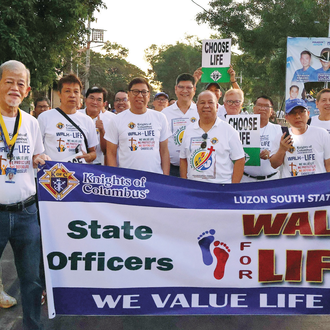 K of C leaders, including Luzon South Deputy Danilo Sanchez (front, third from right), participate in the jurisdiction’s Walk for Life in Malabon City. 