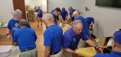 Knights from St. Brendan Council 11208 in Hilliard, Ohio, and other volunteers assemble macaroni and cheese dinner packages for the Hilliard Food Pantry and Chillicothe VA Food Bank. Council 11208 raised more than $7,800 to fund enough food and supplies for 2,000 dinner packages.