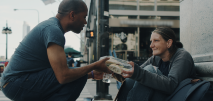 A man hands out food