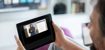Man viewing Protecting our Children video on tablet.