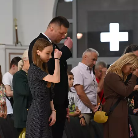 Man and daughter praying