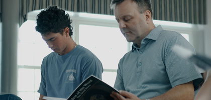 Man and his son partake in Men of the Word Bible Study.