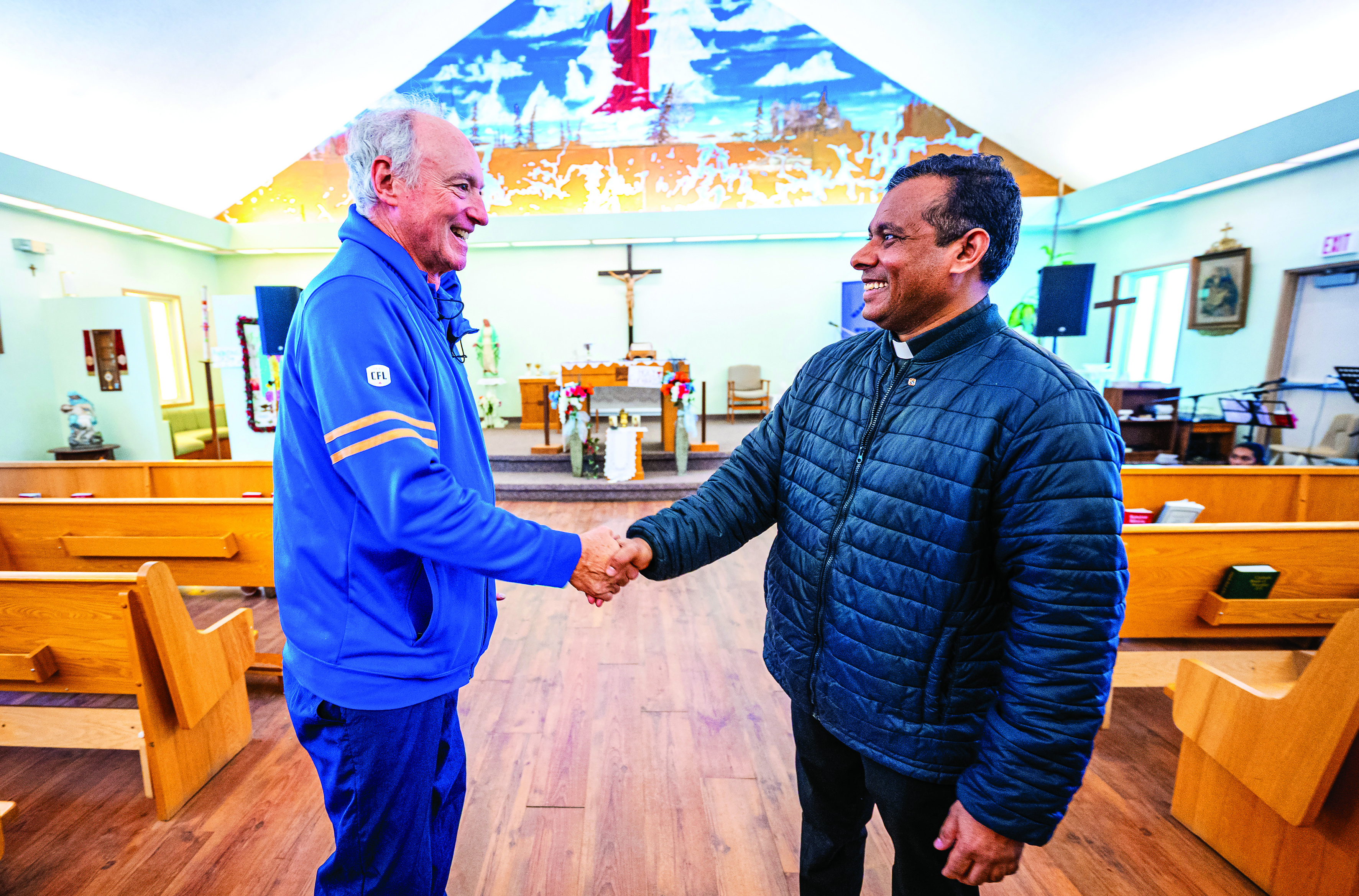 Manitoba State Deputy Mark Desjardins greets Fransalian Father Dhana Raju Amarlapudi.