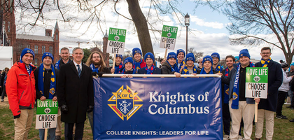 Supreme Knight Patrick Kelly meets with college Knights before the March for Life rally begins.