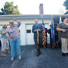 Residents of Marian Homes cut the ribbon at the opening of Our Lady of Guadalupe Home in Winchester, Va.