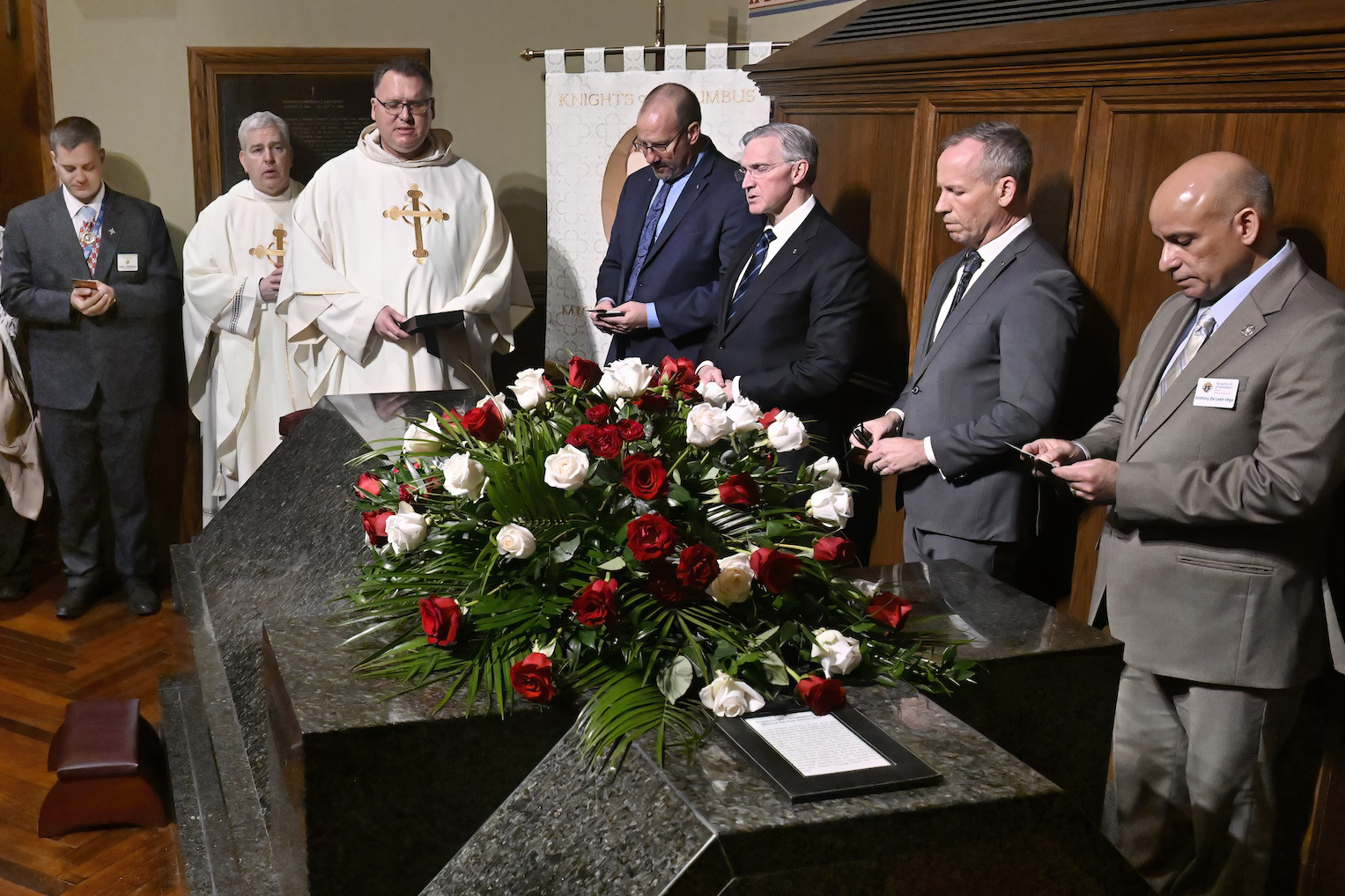Knights of Columbus leaders pray at the tomb of Blessed Michael McGivney