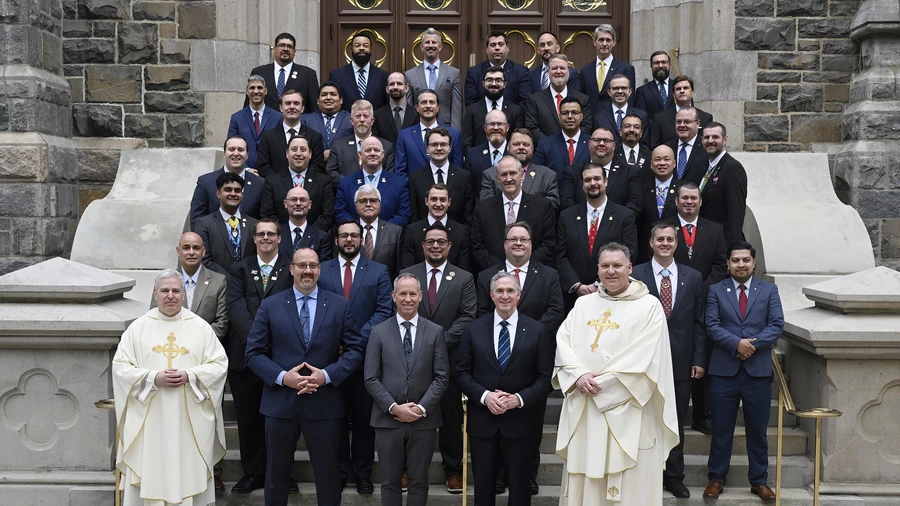 The inaugural graduating class of the McGivney Fellowship stands outside St. Mary’s Church in New Haven, Conn.