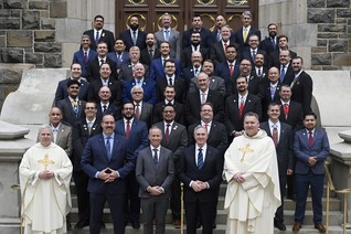 The inaugural graduating class of the McGivney Fellowship stands outside St. Mary’s Church in New Haven, Conn.