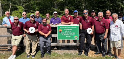 Knights from St. Matthew Council 14360 in Norwalk, Conn., assemble at the council’s Father Michael McGivney Playground at St. Matthew Church during an open house hosted by the council. More than 300 people attended, and the Knights provided children with ice cream, drinks and frisbees.