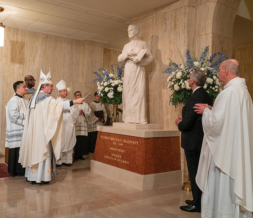 Cardinal Christophe Pierre, apostolic nuncio to the United States, blesses the new statue with holy water