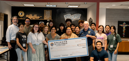 Grand Knight Clay Evans (holding check, right) and Deputy Grand Knight Bill Sanchez (leftmost) of Bishop Nicholas A. Gallagher Council 8482 in Houston present a $1,200 check to staff and summer interns of the communications department at Prince of Peace Parish to help fund the parish’s summer communications internship program. About 20 Catholics ages 14 to 25 learned about media and ministry every Tuesday for eight weeks. Council 8482’s donation covered meals, shirts and supplies.