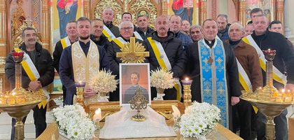 Members of Holy Mother of God Council 18186 in Pidkamin, Ukraine, stand together with a first-class relic of Blessed Michael McGivney after a prayer service at Dormition of the Holy Mother of God Ukrainian Greek Catholic Church.