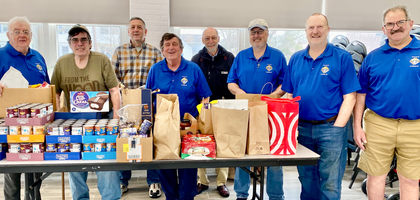 Members of Our Lady of Peace Council 61 in Stratford, Conn., gather behind some of the more than 1,000 pounds of food received from the council’s monthly Food for Families collection.