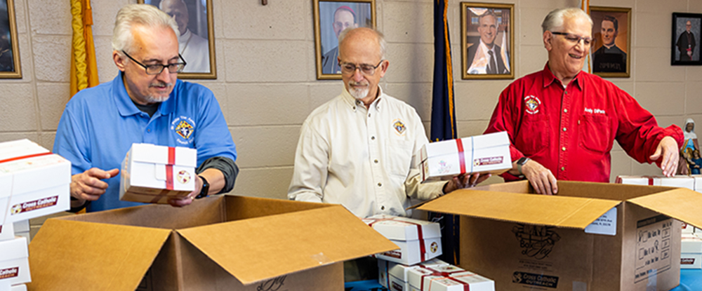 Members of St. Philip the Apostle Council 17028 pack some of the 250 Boxes of Joy collected from council members and parishioners of St. Philip the Apostle Parish in Lancaster, Pa., Nov. 7. (Photo by Michael Miville)